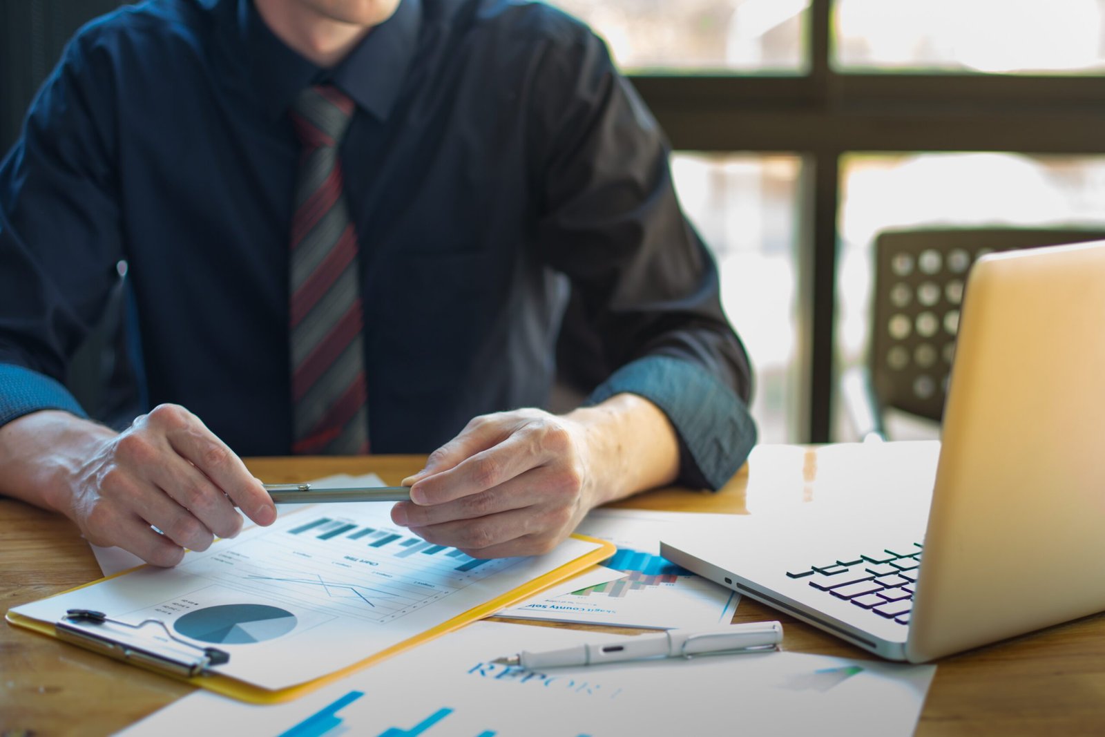 business documents on office table and graph business with socia